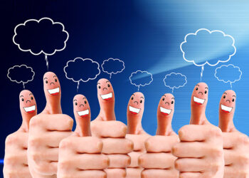 group of finger faces with social chat sign and speech bubbles