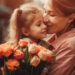 Little girl holding flowers, hugging her mother and celebrating mother's day.