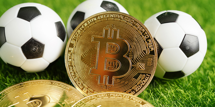 Gold bitcoin with soccer ball or football, cryptocurrency used in online sports betting.