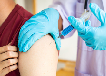 Doctors are vaccinating a new strain of flu patients to prevent the spread of the disease and the epidemic in all ages, Vaccination against communicable diseases concept