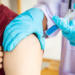 Doctors are vaccinating a new strain of flu patients to prevent the spread of the disease and the epidemic in all ages, Vaccination against communicable diseases concept